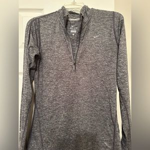 Nike, gray, long-sleeved 3/4 front zip shirt. Fitted and moisture absorbing.